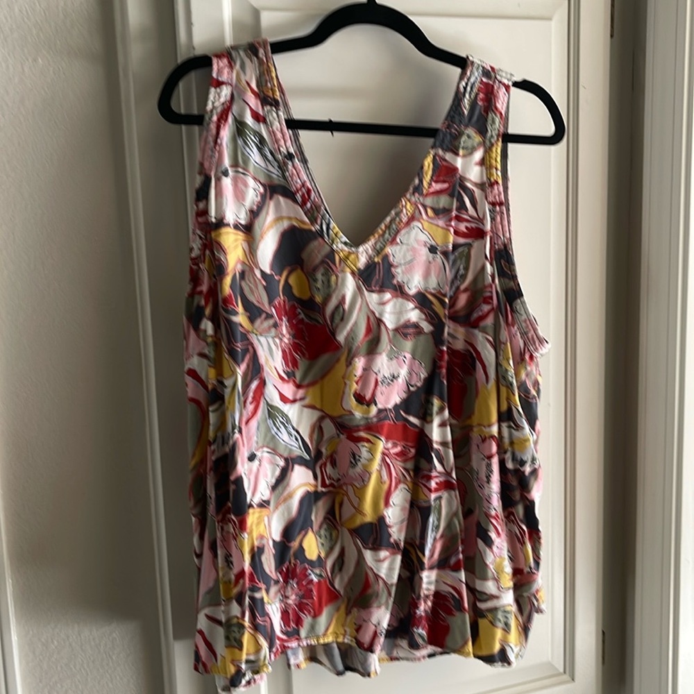 Sleeveless cotton top. Cute lightened colors.  Never worn but washed.